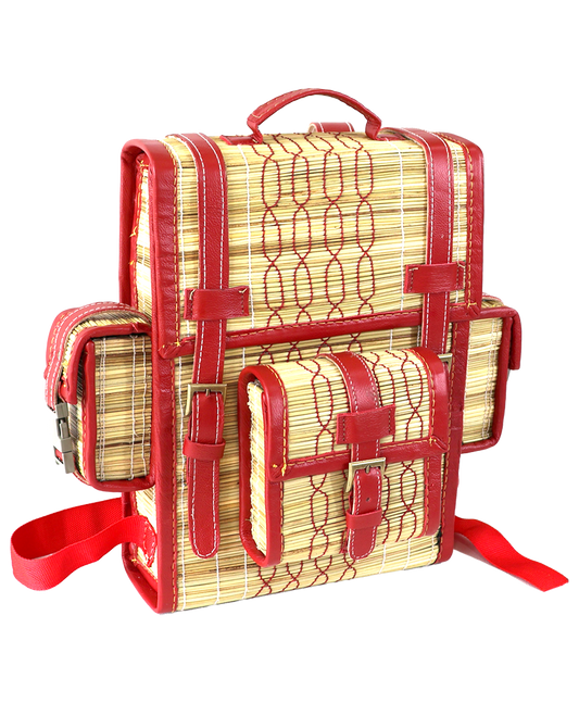 Woven reed backpack with red leather trim and buckle straps