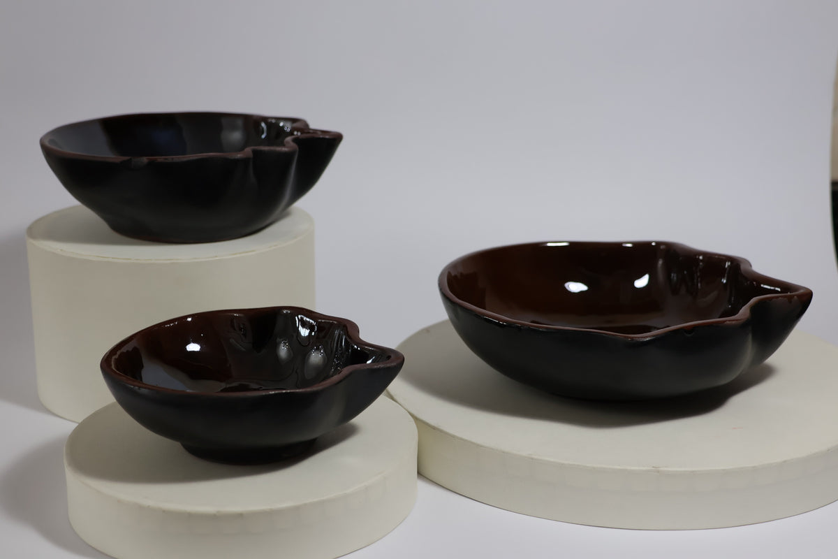 Top view of three nesting cobalt blue ceramic bowls
